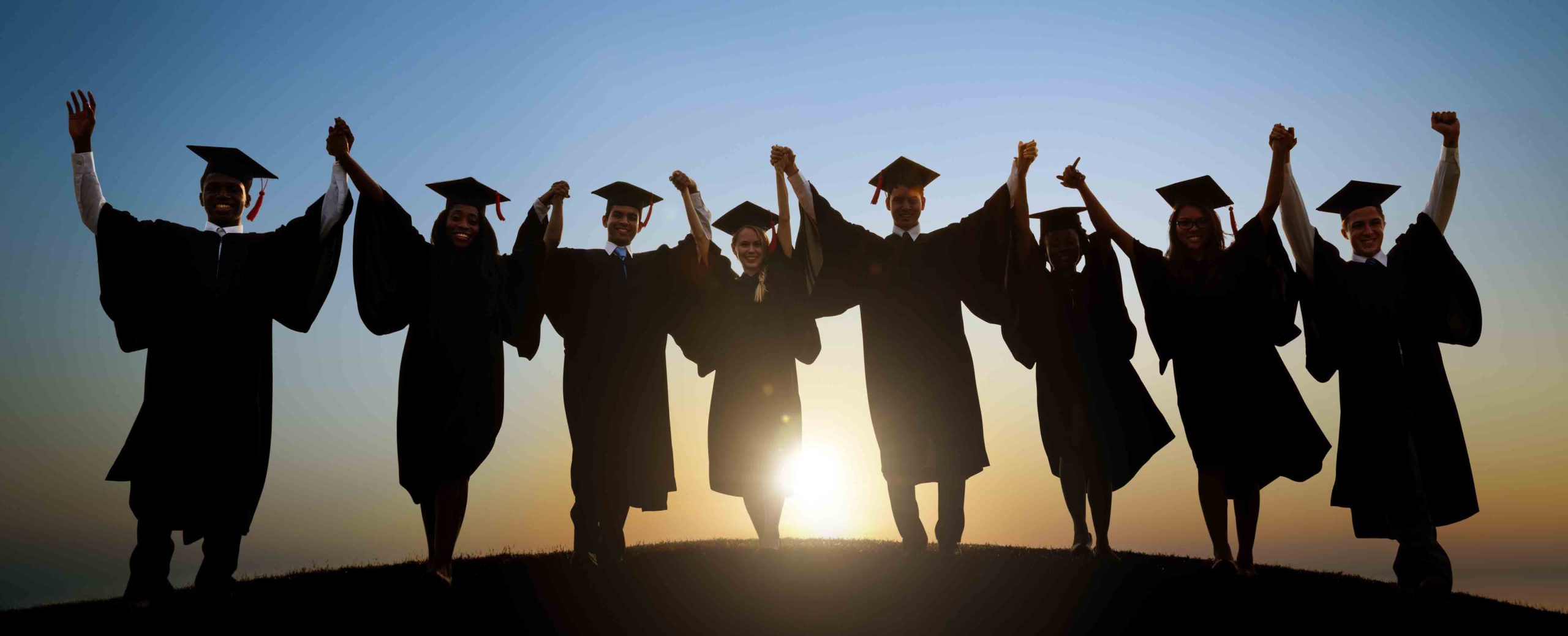 Graduates holding hands scaled