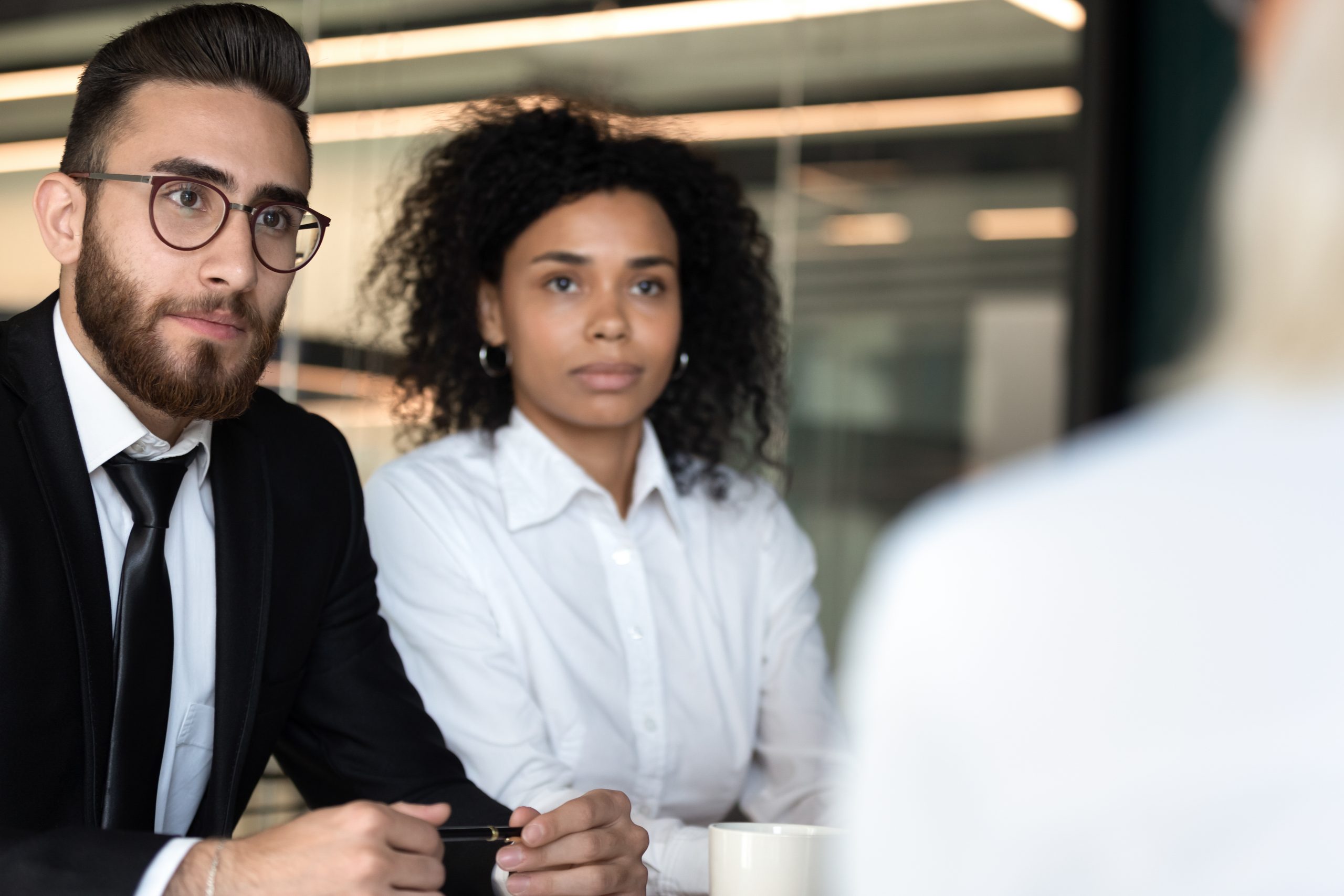 Diverse hr managers listening to job applicant during interview