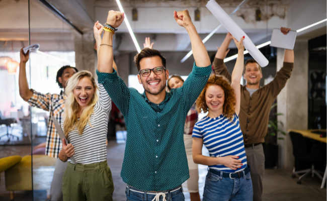 happy team celebrating great company culture