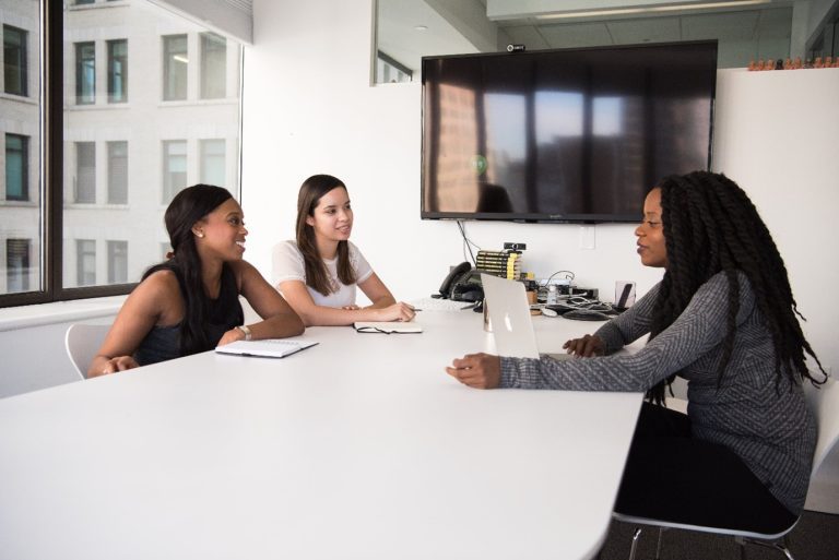 female employees working together in a meeting to achieve tasks