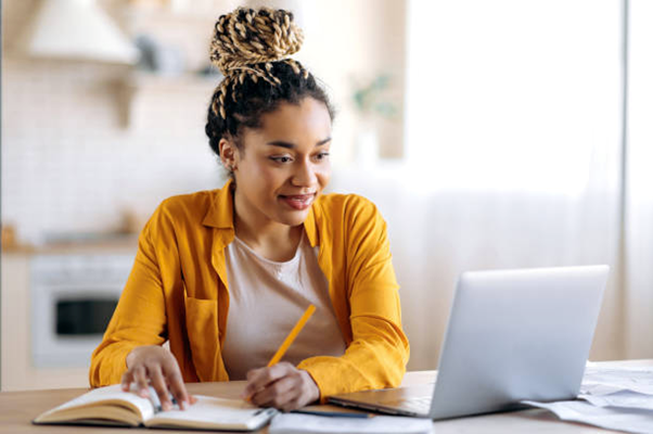 gen z gen x woman learning digitally to improve her skills in the workplace so she can work up the corporate ladder and become a leader