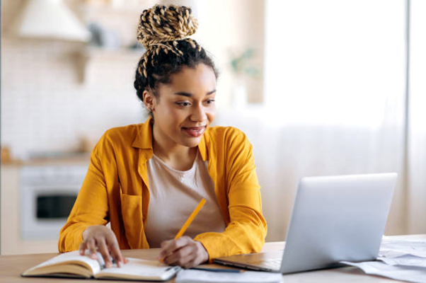 woman learning digitally to improve her skills in the workplace so she can work up the corporate ladder and become a leader