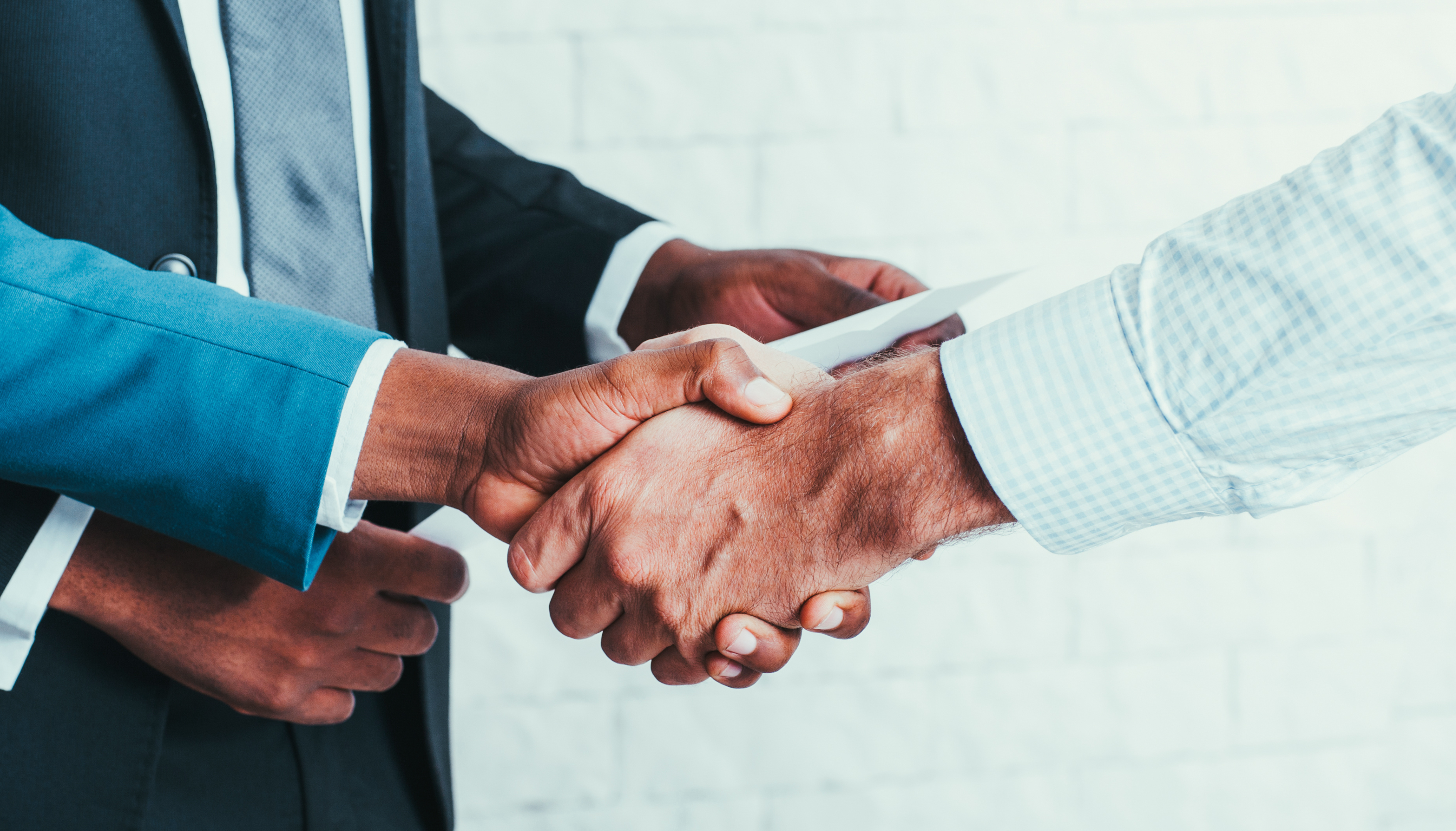 labour relations handshake showing trust to improve productivity and an agreement under a legal labour law dispute