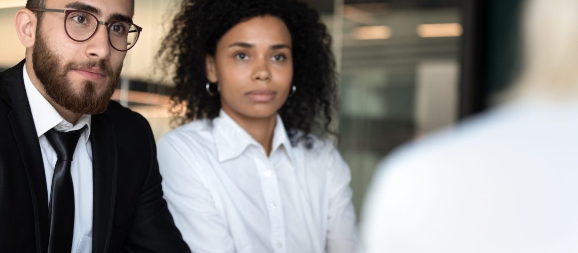 Diverse hr managers listening to job applicant during interview