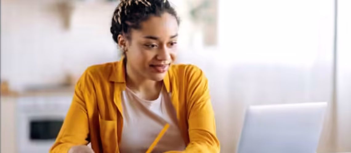 gen z gen x woman learning digitally to improve her skills in the workplace so she can work up the corporate ladder and become a leader