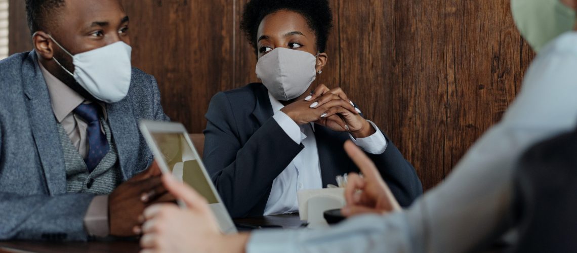 business-people-wearing-face-masks-and-talking-4427957