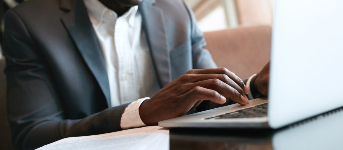 businessman_working_on_computer_in_suit