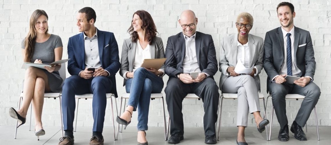 employees_happy_sitting_in_chairs