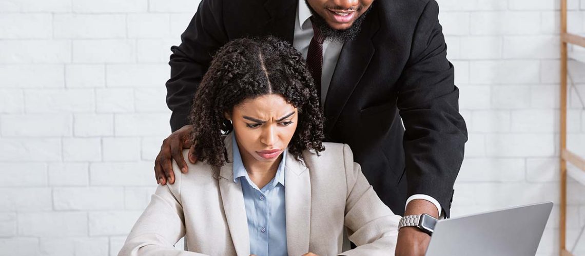 A female employee being sexually harassed by a male employee and making her feel uncomfortable and not safe in the workplace emotionally or mentally