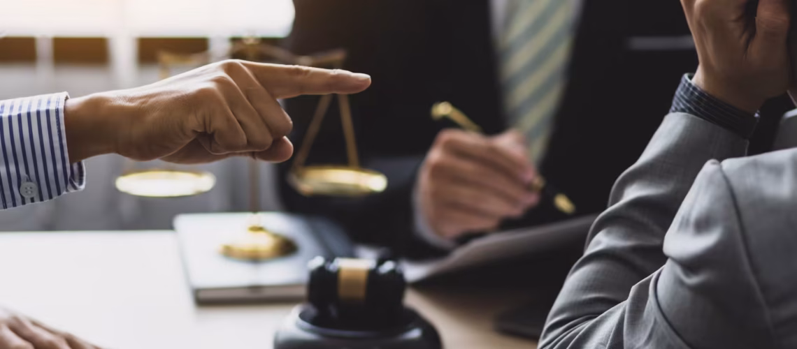 wage claims under salary being discussed where an employee is pointing at an employer regarding payroll in a labour law and legal environment where there is a dispute and arbitration is taking place