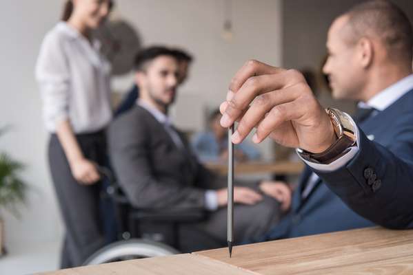 businessman holding pencil in meeting meeting hr strategy leader lead leadership