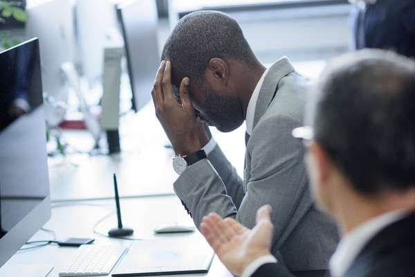 businessman_head_in_hands_stressed mental health wellness wellbeing team argument bad leadership